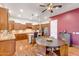 Well-equipped kitchen with wood cabinetry, granite countertops, and an adjacent breakfast nook, offering ample seating at 2103 E Canyon Pl, Chandler, AZ 85249