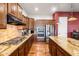 A kitchen features granite countertops, stainless steel appliances, and lots of cabinet space for ample storage at 2103 E Canyon Pl, Chandler, AZ 85249
