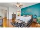 This main bedroom features modern decor, a large bed, hardwood floors, and stylish furnishings at 2103 E Canyon Pl, Chandler, AZ 85249