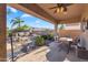 Enjoy outdoor living with this lovely patio with covered seating and landscaped yard at 2103 E Canyon Pl, Chandler, AZ 85249