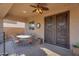 Wonderful covered patio with decorative double doors and a ceiling fan to keep you cool at 2103 E Canyon Pl, Chandler, AZ 85249