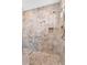 Tiled walk-in shower with a built-in shelf, a shower head, and a grab bar for accessibility at 2103 E Canyon Pl, Chandler, AZ 85249
