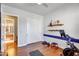 Workout room with shelving, closet doors, hardwood floors and exercise equipment at 2103 E Canyon Pl, Chandler, AZ 85249