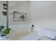 Bright bathroom featuring a soaking tub, toilet, and plant at 2135 S Bristol --, Mesa, AZ 85209