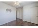 Bedroom with laminate flooring, closet and wall mounted television at 2135 S Bristol --, Mesa, AZ 85209