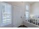 Bright entryway has large windows and a staircase that leads to a cozy living space at 2135 S Bristol --, Mesa, AZ 85209