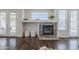 Close-up of a stone fireplace with a raised hearth and built-in shelving in a well-lit living room at 2135 S Bristol --, Mesa, AZ 85209