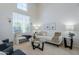 Inviting living room with a soaring window and neutral decor providing a serene space for relaxation at 2135 S Bristol --, Mesa, AZ 85209