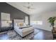 Bright main bedroom features a modern ceiling fan and large windows providing lots of natural light at 2135 S Bristol --, Mesa, AZ 85209