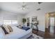 Spacious main bedroom with a tray on the bed and doorway to bathroom and laundry at 2135 S Bristol --, Mesa, AZ 85209