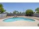 Backyard pool with a rock waterfall feature and lush landscaping at 2135 S Bristol --, Mesa, AZ 85209