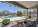 Relaxing outdoor patio with a private pool, desert landscaping, and charming string lights for evening ambiance at 2135 S Bristol --, Mesa, AZ 85209