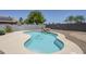 Backyard pool with a rock waterfall feature and lush landscaping at 2135 S Bristol --, Mesa, AZ 85209