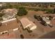 Aerial view of a one story home in a neighborhood next to a golf course at 22609 S 214Th Way, Queen Creek, AZ 85142