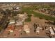 High altitude view of a golf course and neighborhood, with the home in the foreground at 22609 S 214Th Way, Queen Creek, AZ 85142