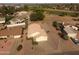 Aerial view of a one story home in a neighborhood next to a golf course at 22609 S 214Th Way, Queen Creek, AZ 85142