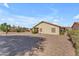 The backyard offers space, low-maintenance landscaping, and a cozy covered patio at 22609 S 214Th Way, Queen Creek, AZ 85142