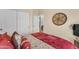 Comfortable bedroom with a closet, an open door to another room, and wall decorations at 22609 S 214Th Way, Queen Creek, AZ 85142