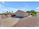Exterior view of a beautiful home featuring a two-car garage and mature landscaping at 22609 S 214Th Way, Queen Creek, AZ 85142
