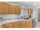 Updated kitchen with marble countertops, light wood cabinets, and stainless steel dishwasher at 22609 S 214Th Way, Queen Creek, AZ 85142