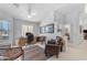 Bright office space with neutral walls, a ceiling fan, large desk and an overstuffed leather chair at 22609 S 214Th Way, Queen Creek, AZ 85142
