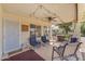 Relaxing covered patio area with comfortable seating and outdoor lighting at 22609 S 214Th Way, Queen Creek, AZ 85142