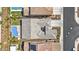Detailed aerial view highlighting the home's roof and a pristine backyard featuring a refreshing pool at 23097 N 95Th Dr, Peoria, AZ 85383