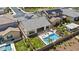 Beautiful home showcasing a well-maintained backyard with a sparkling pool and desert landscaping at 23097 N 95Th Dr, Peoria, AZ 85383