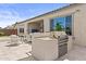 Outdoor built-in grill and patio furniture create the perfect entertaining space with a smooth transition from indoor to outdoor at 23097 N 95Th Dr, Peoria, AZ 85383