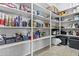 Spacious walk-in pantry featuring floor-to-ceiling shelving for ample storage, complete with household goods and supplies at 23097 N 95Th Dr, Peoria, AZ 85383