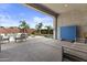 Inviting covered patio with comfortable seating and a view of the refreshing pool at 23097 N 95Th Dr, Peoria, AZ 85383
