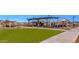 Community playground with soft turf and various recreational activities for children at 23097 N 95Th Dr, Peoria, AZ 85383