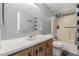 A cozy bathroom features a vanity, toilet, and shower with tub, offering functionality at 245 S 56Th St # 135, Mesa, AZ 85206