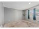 Bedroom with neutral walls, carpet, and a window providing natural light at 245 S 56Th St # 135, Mesa, AZ 85206