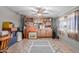 Spacious bonus room with ceiling fan, tile floor and ample storage cabinets; versatile living area at 245 S 56Th St # 135, Mesa, AZ 85206