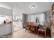 Cozy dining area featuring a wooden table and chairs, leading into a well-lit kitchen area at 245 S 56Th St # 135, Mesa, AZ 85206