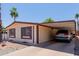 This single-story home has desert landscaping, a carport, and a warm, inviting atmosphere at 245 S 56Th St # 135, Mesa, AZ 85206