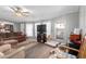 Inviting living room featuring a ceiling fan, lots of light, and comfortable furniture for cozy living at 245 S 56Th St # 135, Mesa, AZ 85206