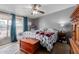 Main bedroom featuring sliding glass doors, ceiling fan, and ample closet space at 245 S 56Th St # 135, Mesa, AZ 85206