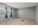 Empty spare room with tiled floors and a large window overlooking a neighborhood at 245 S 56Th St # 135, Mesa, AZ 85206