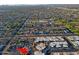 Wide aerial shot of a vibrant neighborhood featuring tree-lined streets, varied housing styles, and a sense of community at 3054 W Redfield Rd, Phoenix, AZ 85053