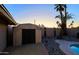 Backyard featuring a storage shed and gravel landscaping at 3054 W Redfield Rd, Phoenix, AZ 85053