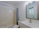 Well-lit bathroom with shower-tub combination and a vanity with a mirror at 3054 W Redfield Rd, Phoenix, AZ 85053