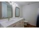 Bright bathroom featuring a double sink vanity with white cabinets, modern fixtures, and a clean, fresh aesthetic at 3054 W Redfield Rd, Phoenix, AZ 85053