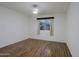 Sunny, empty bedroom with stylish flooring and natural light, creating a cozy and inviting space at 3054 W Redfield Rd, Phoenix, AZ 85053