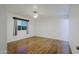Bright, empty bedroom with modern ceiling light and new flooring at 3054 W Redfield Rd, Phoenix, AZ 85053