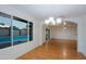 Bright dining room boasts tile floors and a view of the sparkling backyard pool at 3054 W Redfield Rd, Phoenix, AZ 85053