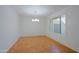 Bright, empty dining room featuring a chandelier and new tile flooring at 3054 W Redfield Rd, Phoenix, AZ 85053