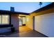 Inviting entrance with a tiled porch and direct access to the garage, combining style and convenience at 3054 W Redfield Rd, Phoenix, AZ 85053