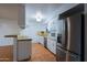 Modern kitchen boasts stainless steel appliances and plenty of cabinet space at 3054 W Redfield Rd, Phoenix, AZ 85053